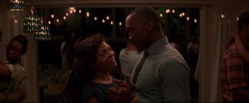 Movie still from “Hidden Figures” (2016), directed by Theodore Melfi – A man and a woman are smiling at each other; Close Up shot, Over the shoulder angle