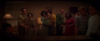Movie still from “Hidden Figures” (2016), directed by Theodore Melfi – A group of people standing around each other; Medium shot, High angle