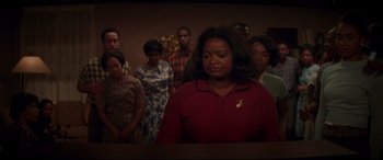 Movie still from “Hidden Figures” (2016), directed by Theodore Melfi – A group of people standing in front of a wall; Medium shot, Over the shoulder angle