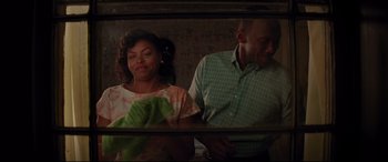 Movie still from “Hidden Figures” (2016), directed by Theodore Melfi – A man and a woman standing next to each other; Medium shot, Over the shoulder angle