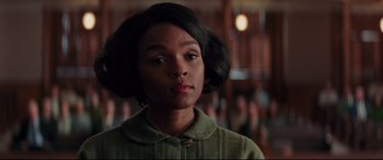 Movie still from “Hidden Figures” (2016), directed by Theodore Melfi – A young woman with short black hair is looking to her left; Close Up shot, Low angle