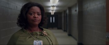 Movie still from “Hidden Figures” (2016), directed by Theodore Melfi – A woman standing in a hallway with a badge on her neck; Close Up shot, Over the shoulder angle