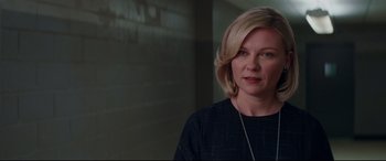 Movie still from “Hidden Figures” (2016), directed by Theodore Melfi – A woman with blonde hair is standing in front of a brick wall; Close Up shot, Over the shoulder angle