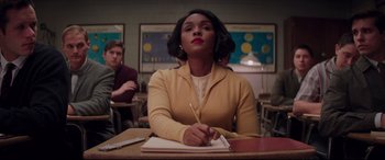 Movie still from “Hidden Figures” (2016), directed by Theodore Melfi – A woman sitting at a table writing on a piece of paper; Medium shot, Over the shoulder angle