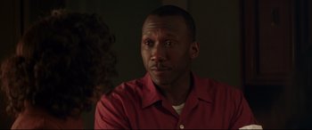 Movie still from “Hidden Figures” (2016), directed by Theodore Melfi – A person wearing a red shirt; Close Up shot, Over the shoulder angle