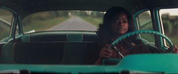 Movie still from “Hidden Figures” (2016), directed by Theodore Melfi – A woman sitting in the passenger seat of a car; Medium shot, Over the shoulder angle