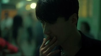 Movie still from “Fallen Angels” (1995), directed by Kar-Wai Wong – A person with a cigarette in their mouth; Close Up shot, High angle