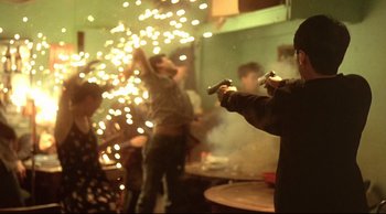 Movie still from “Fallen Angels” (1995), directed by Kar-Wai Wong – A group of people playing a video game in a room; Medium shot, Low angle