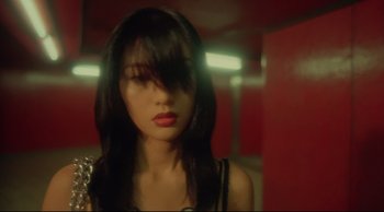 Movie still from “Fallen Angels” (1995), directed by Kar-Wai Wong – A woman with long black hair wearing a black top; Close Up shot, High angle