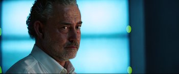 Movie still from “Hitman: Agent 47” (2015), directed by Aleksander Bach – An older man with gray hair and a white beard; Close Up shot, Low angle