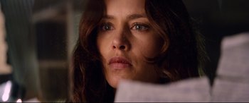 Movie still from “Hitman: Agent 47” (2015), directed by Aleksander Bach – A woman's face looking at a piece of paper; Close Up shot, Over the shoulder angle