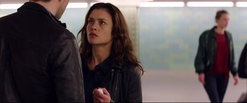 Movie still from “Hitman: Agent 47” (2015), directed by Aleksander Bach – A woman standing next to a man; Medium shot, Over the shoulder angle