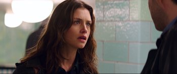 Movie still from “Hitman: Agent 47” (2015), directed by Aleksander Bach – A person with long brown hair; Close Up shot, Over the shoulder angle