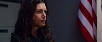 Movie still from “Hitman: Agent 47” (2015), directed by Aleksander Bach – A person with a bruised face; Close Up shot, Over the shoulder angle