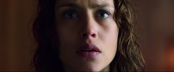 Movie still from “Hitman: Agent 47” (2015), directed by Aleksander Bach – A woman's face with green eyes; Close Up shot, Low angle