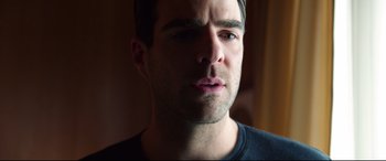 Movie still from “Hitman: Agent 47” (2015), directed by Aleksander Bach – A man's face in a dark room; Close Up shot, Over the shoulder angle