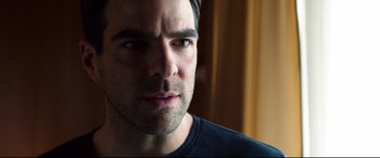 Movie still from “Hitman: Agent 47” (2015), directed by Aleksander Bach – A man's face in a dark room; Close Up shot, Over the shoulder angle