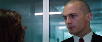 Movie still from “Hitman: Agent 47” (2015), directed by Aleksander Bach – A man with a shaved head looking to his left; Close Up shot, Low angle