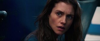 Movie still from “Hitman: Agent 47” (2015), directed by Aleksander Bach – A person with long brown hair; Close Up shot, Over the shoulder angle