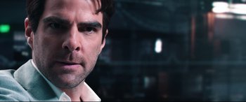 Movie still from “Hitman: Agent 47” (2015), directed by Aleksander Bach – A man's face in a dark room; Close Up shot, Over the shoulder angle