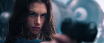 Movie still from “Hitman: Agent 47” (2015), directed by Aleksander Bach – A person with long hair; Close Up shot, Low angle