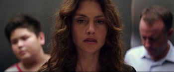 Movie still from “Hitman: Agent 47” (2015), directed by Aleksander Bach – A person with long brown hair; Close Up shot, Low angle