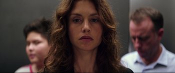 Movie still from “Hitman: Agent 47” (2015), directed by Aleksander Bach – A person with long brown hair; Close Up shot, Low angle