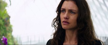 Movie still from “Hitman: Agent 47” (2015), directed by Aleksander Bach – A person with long brown hair; Close Up shot, Over the shoulder angle