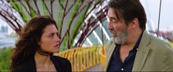 Movie still from “Hitman: Agent 47” (2015), directed by Aleksander Bach – A man and a woman standing next to each other; Close Up shot, Over the shoulder angle