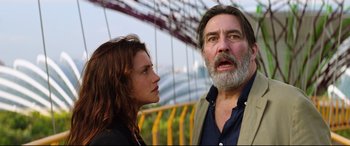 Movie still from “Hitman: Agent 47” (2015), directed by Aleksander Bach – A man and a woman standing next to each other near a bridge; Close Up shot, Low angle