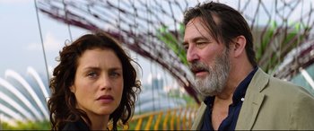 Movie still from “Hitman: Agent 47” (2015), directed by Aleksander Bach – A man and a woman standing next to each other on a bridge; Close Up shot, Over the shoulder angle