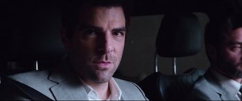 Movie still from “Hitman: Agent 47” (2015), directed by Aleksander Bach – A person wearing a suit and tie; Close Up shot, Over the shoulder angle