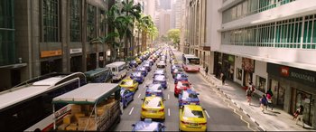 Movie still from “Hitman: Agent 47” (2015), directed by Aleksander Bach – A street filled with lots of taxis and buses driving down it; Extreme Wide shot, High angle