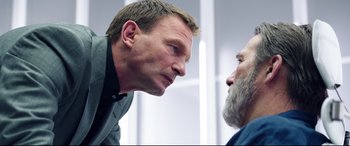 Movie still from “Hitman: Agent 47” (2015), directed by Aleksander Bach – Two men face each other in a room; Close Up shot, Over the shoulder angle
