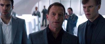 Movie still from “Hitman: Agent 47” (2015), directed by Aleksander Bach – A person wearing a suit and tie; Close Up shot, Over the shoulder angle