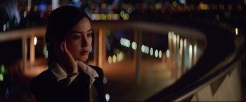 Movie still from “Hitman: Agent 47” (2015), directed by Aleksander Bach – A woman in a black jacket is standing in front of lights; Close Up shot, Low angle