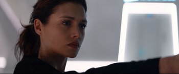 Movie still from “Hitman: Agent 47” (2015), directed by Aleksander Bach – A woman's face in a black shirt; Close Up shot, Over the shoulder angle