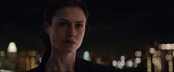 Movie still from “Hitman: Agent 47” (2015), directed by Aleksander Bach – A person wearing a black shirt; Close Up shot, Over the shoulder angle