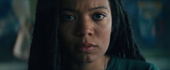 Movie still from “Gen V” (2023), created by Eric Kripke – A woman's face with dreadlocks; Close Up shot, Low angle