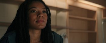 Movie still from “Gen V” (2023), created by Eric Kripke – A person with dreads looking at the camera; Close Up shot, Low angle
