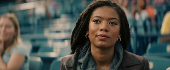 Movie still from “Gen V” (2023), created by Eric Kripke – A person with dreads looking at the camera; Close Up shot, Over the shoulder angle