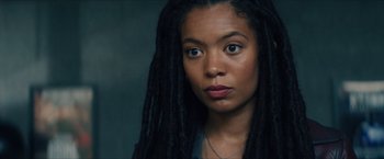 Movie still from “Gen V” (2023), created by Eric Kripke – A person with dreadlocks; Close Up shot, Over the shoulder angle