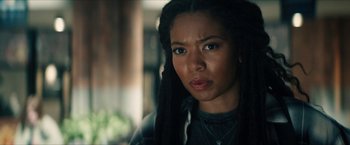 Movie still from “Gen V” (2023), created by Eric Kripke – A person with dreads looking at the camera; Close Up shot, Over the shoulder angle