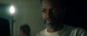 Movie still from “Gen V” (2023), created by Eric Kripke – A person wearing a white shirt; Close Up shot, Over the shoulder angle