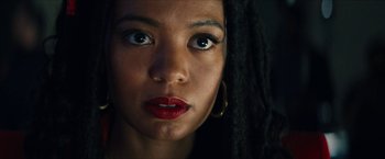 Movie still from “Gen V” (2023), created by Eric Kripke – A person's face with long dreadlocks; Close Up shot, Low angle