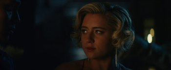 Movie still from “Gen V” (2023), created by Eric Kripke – A person with short blonde hair; Close Up shot, Over the shoulder angle