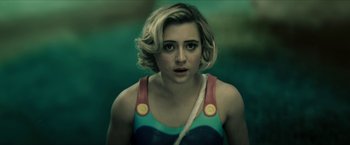 Movie still from “Gen V” (2023), created by Eric Kripke – A person with short blonde hair; Close Up shot, Over the shoulder angle