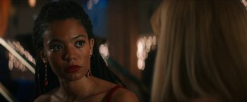 Movie still from “Gen V” (2023), created by Eric Kripke – A person wearing a red dress; Close Up shot, Over the shoulder angle