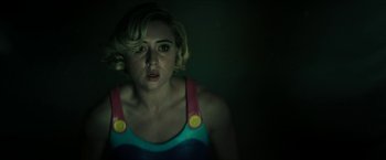 Movie still from “Gen V” (2023), created by Eric Kripke – A woman with blonde hair is looking at the camera; Close Up shot, Over the shoulder angle