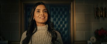 Movie still from “Gen V” (2023), created by Eric Kripke – A woman with long black hair wearing a sweater; Close Up shot, Low angle